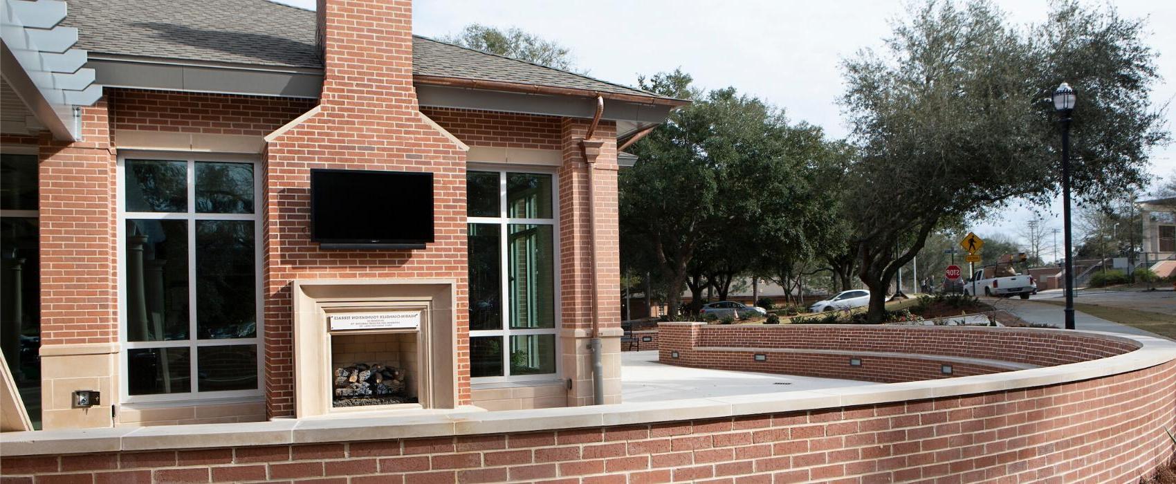 Outside patio with fireplace of MacQueen Center